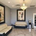 Spa lobby with elegant artwork, a chandelier, and comfortable seating